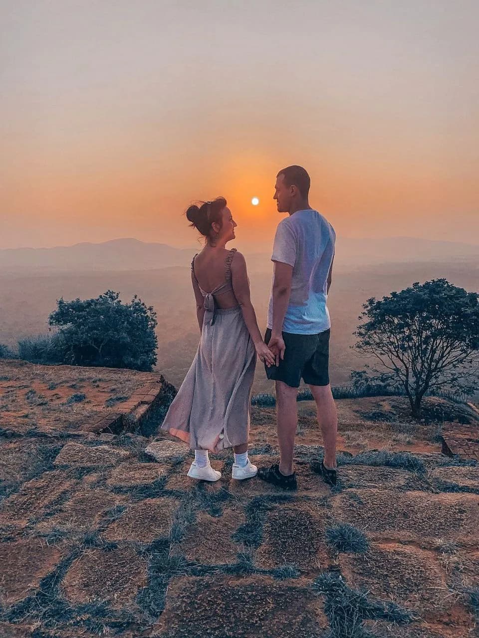 Couple watching the sunset over Sri Lanka's hill country