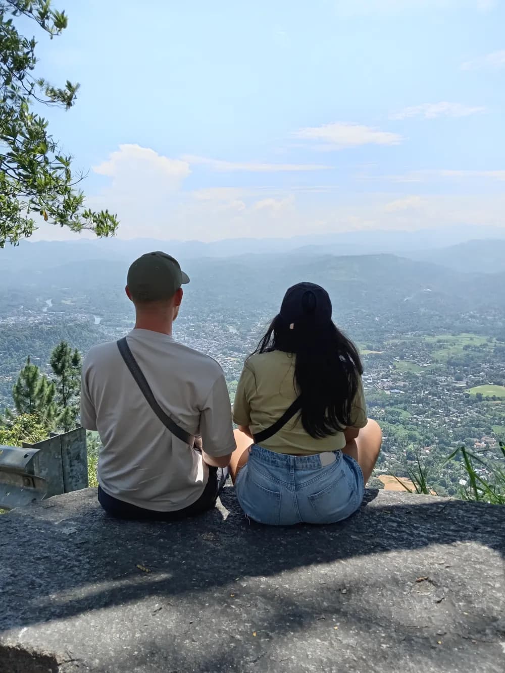 Travellers overlooking the Sri Lankan hill country